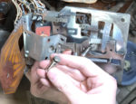 Bracket with coil and sleeve